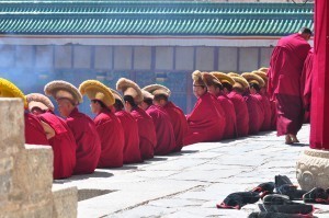 China motorcycle tour experiences prayer time at the Labrang Monastery