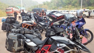 China motorcycle tour enters China at the Laos international border crossing Group motorcycle tour into China